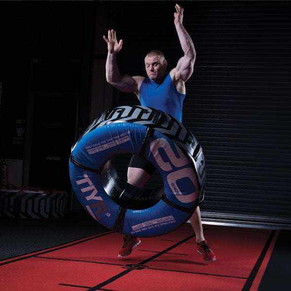 100kg220lbs TIYR Black training tyre in blue and black synthetic material, with segmented panels and integrated handles