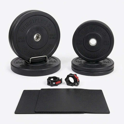 7 ft Olympic power bar is not visible; black weight plates, two black and red collars, and a textured mat are shown