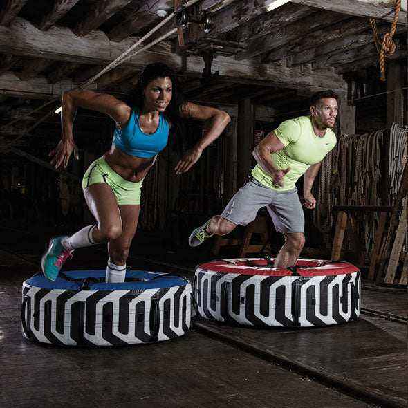 Training tyre platforms in black and white with bold patterns and red and blue top surfaces; Inside Diameter 20"
